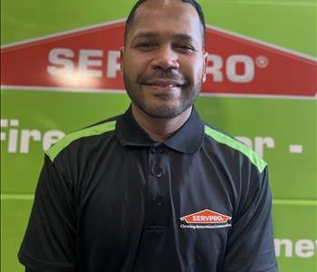 Photo of male SERVPRO employee with a green background