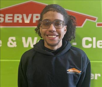 Photo of male SERVPRO employee with a green background